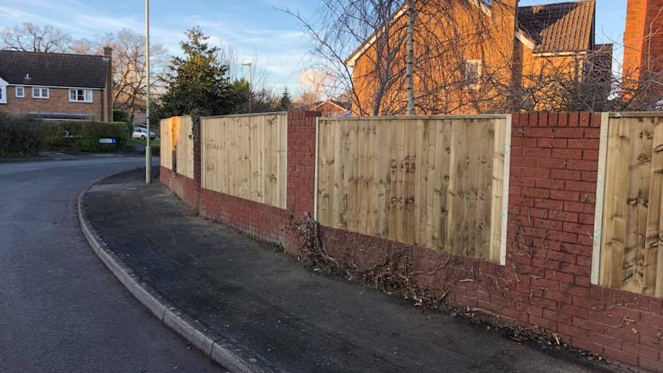 A customers fence we erected that has close boards and fixed between walls. 