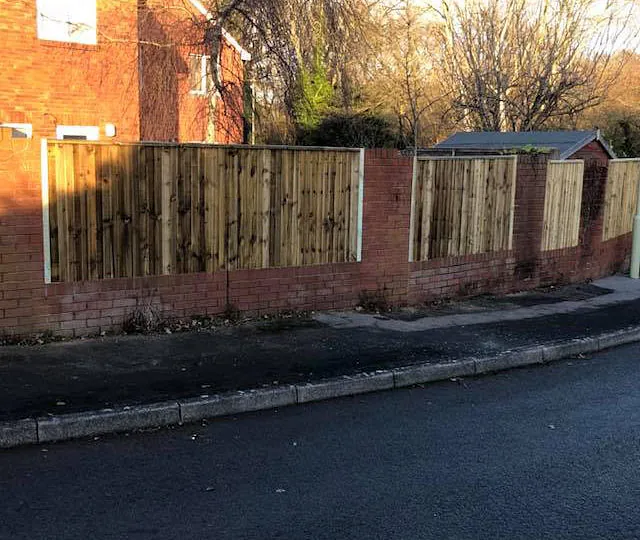 A customers fence we erected that has close boards and fixed between walls. 