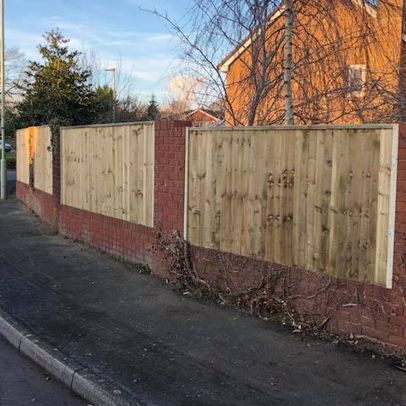 A customers fence we erected that has close boards and fixed between walls. 
