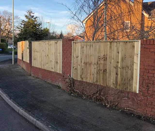 A customers fence we erected that has close boards and fixed between walls. 